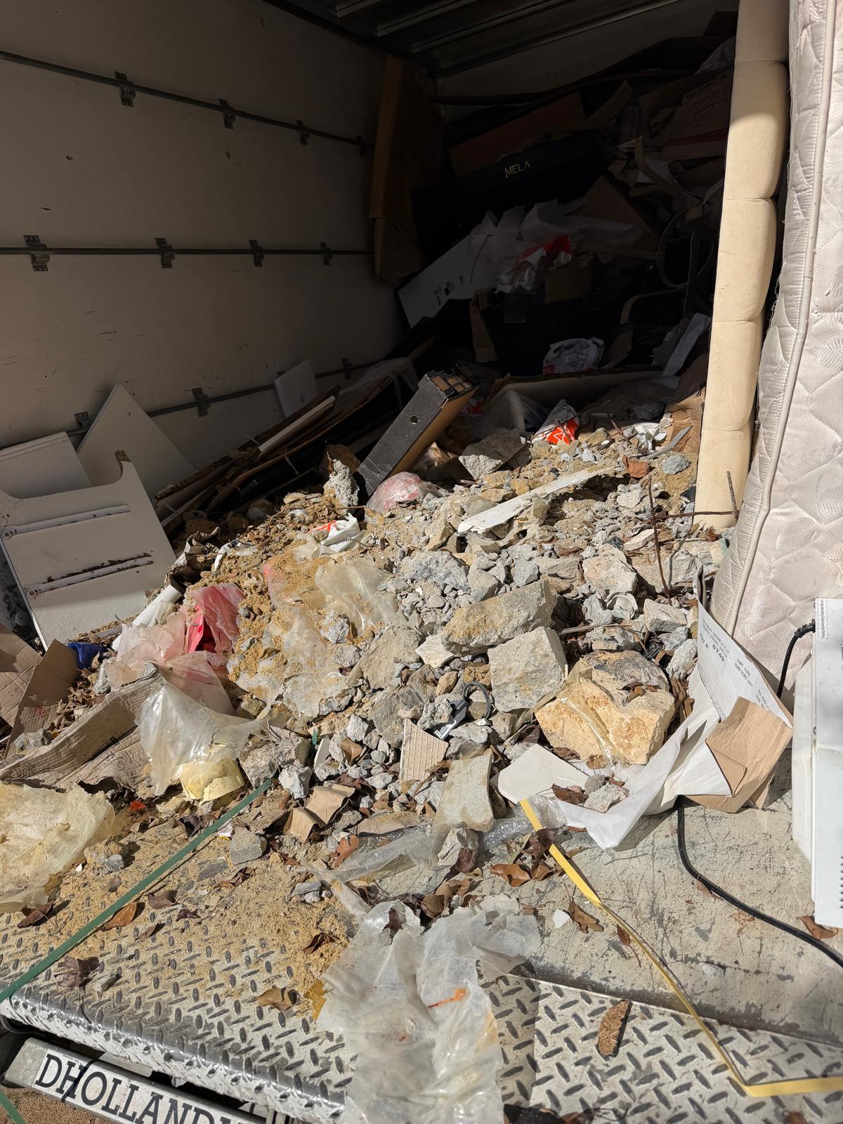 Heavy building rubble and concrete waste removal truck load in Perth